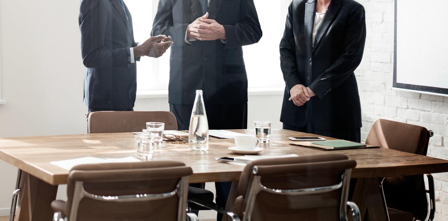 Ceos talking at desk